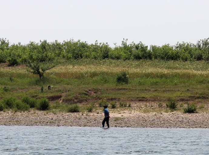 中朝边境美丽的风景,中朝边境桃花盛开的地方