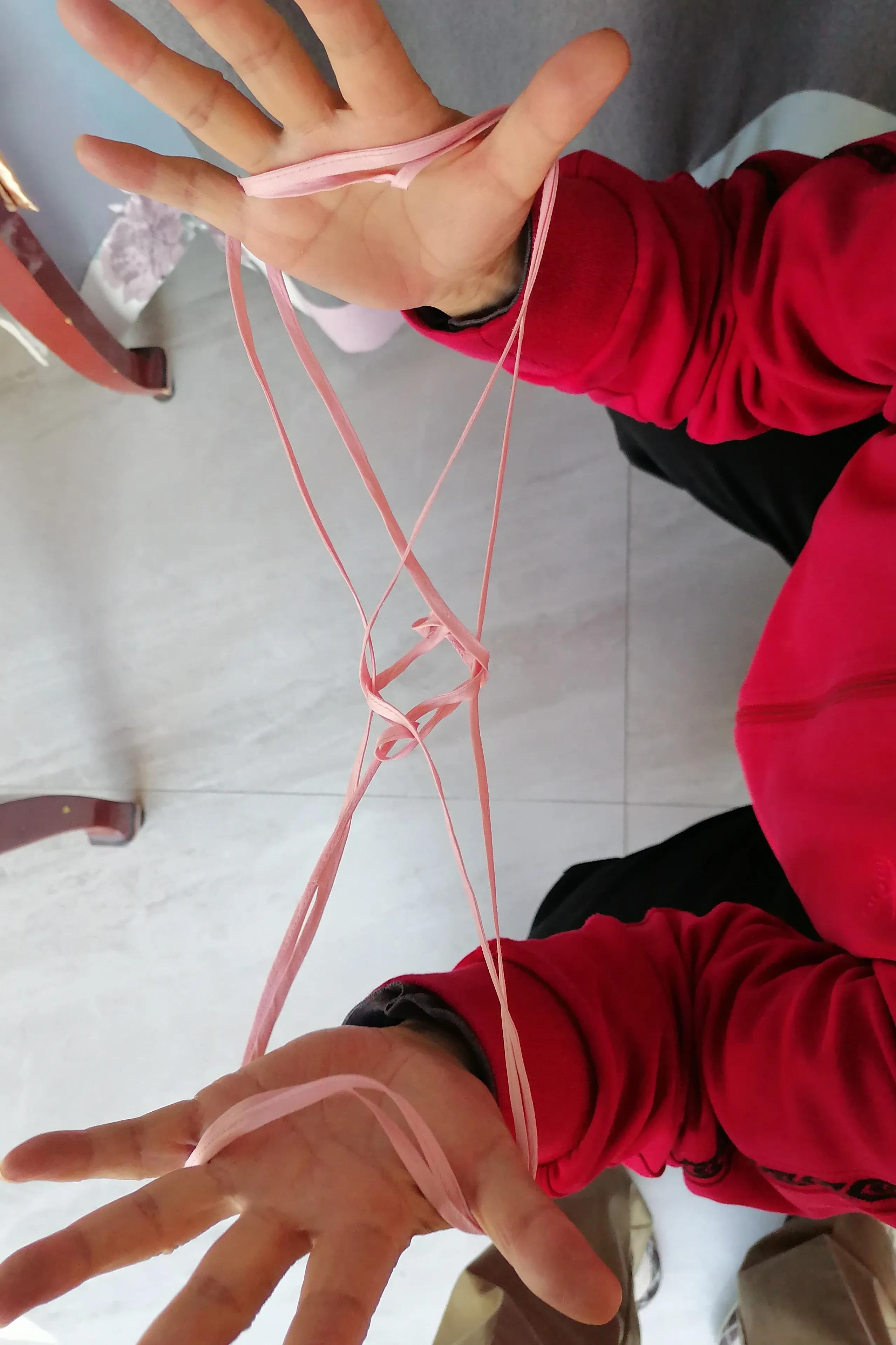 翻花绳游戏过程100字,两人玩的翻花绳游戏小技巧